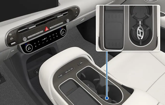 Hyundai render of a smart key sitting in a marked emergency slot in the center console tray, with an inset zoom